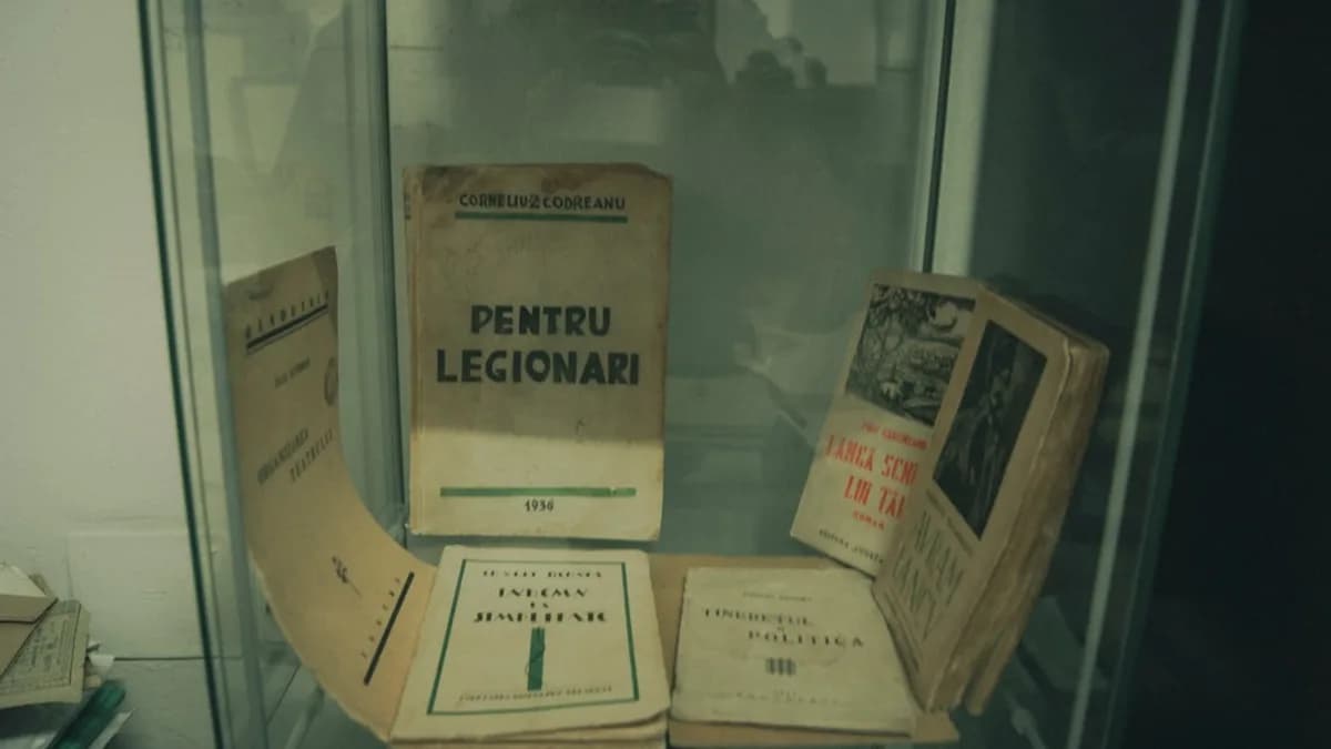 Old books displayed in a glass cabinet