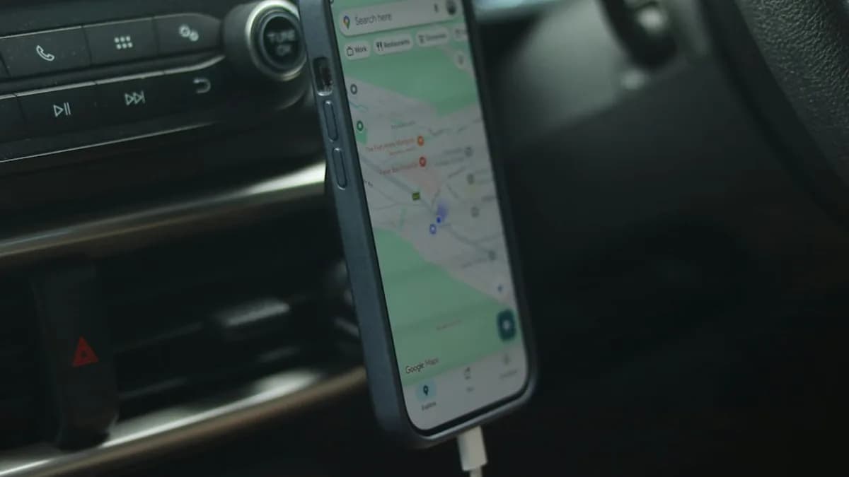 Smartphone with navigation app mounted in car