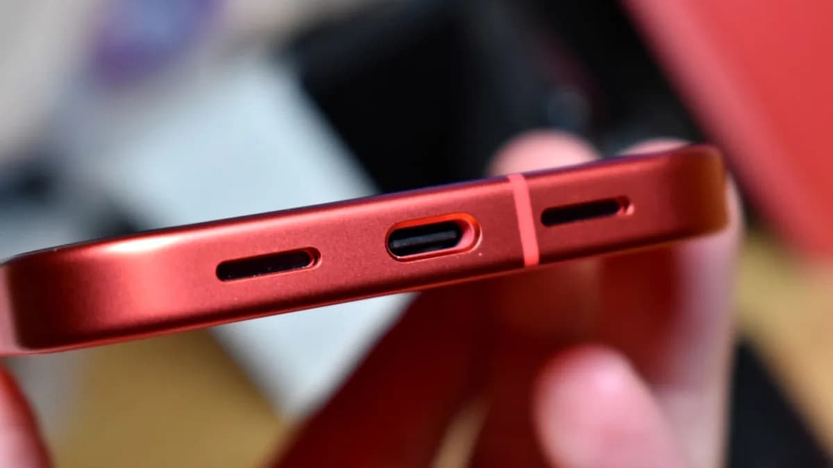 Close-up of a red smartphone charging port