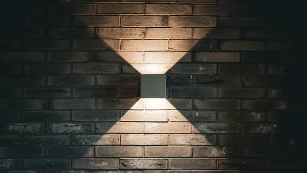 Square light fixture on a brick wall