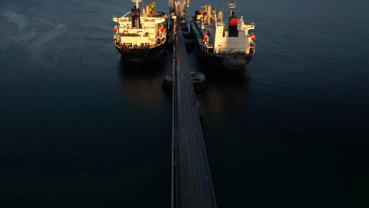 two large ships in the middle of a body of water