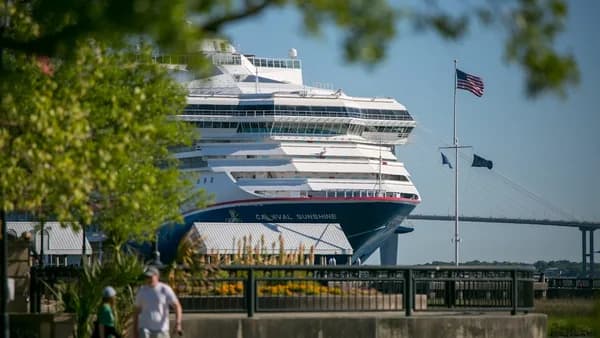 A large cruise ship docked in a harbor