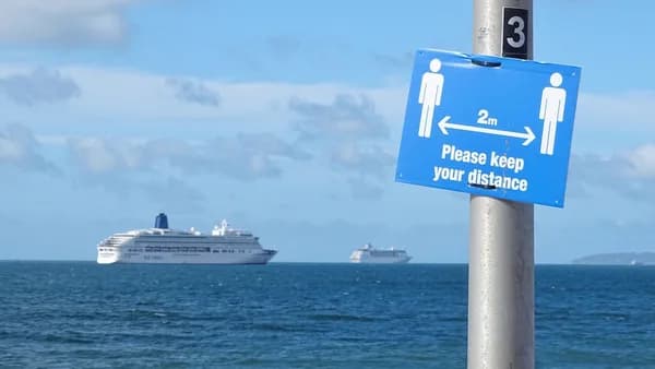 white cruise ship on sea under blue sky during daytime