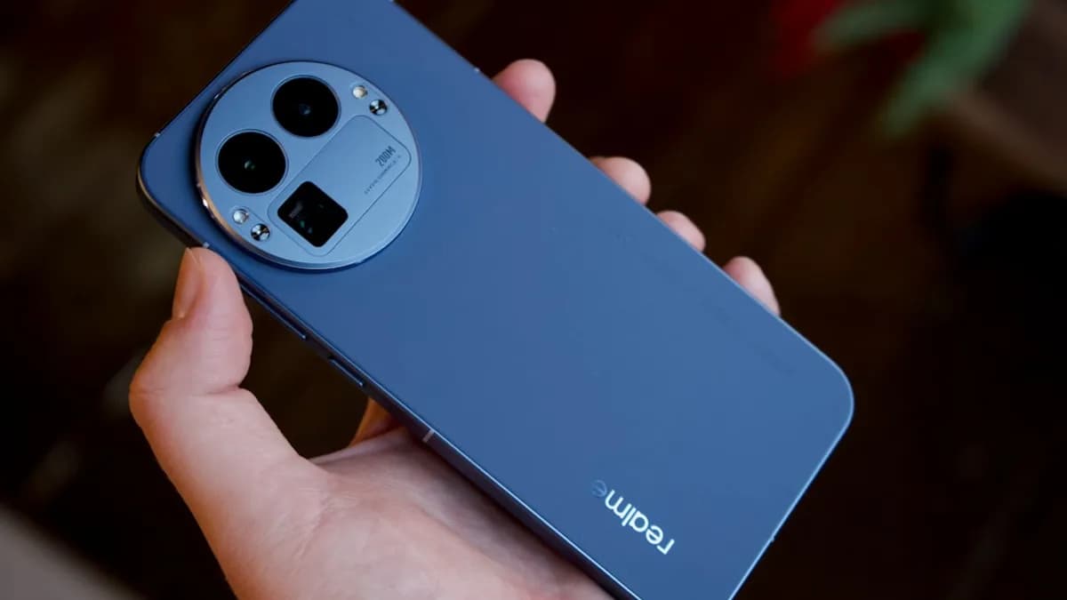 Hand holding a blue smartphone with a circular camera module.