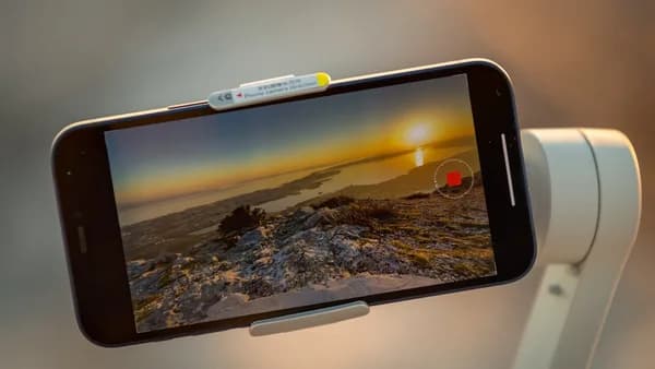 a person taking a picture with a cell phone