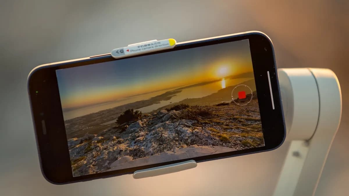 a person taking a picture with a cell phone