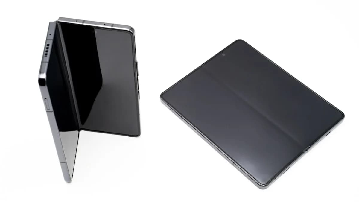 a black tablet and a silver tablet on a white background