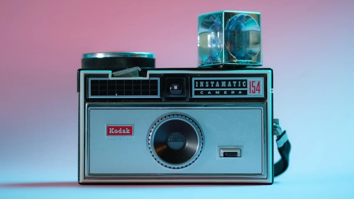 black and silver camera on white table