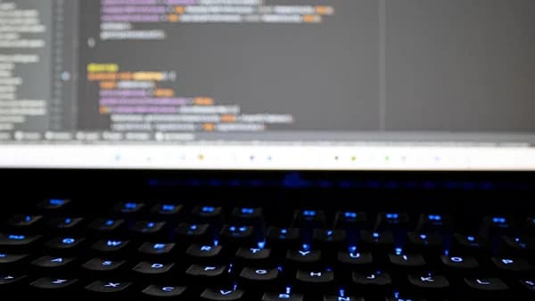 a computer keyboard with a monitor