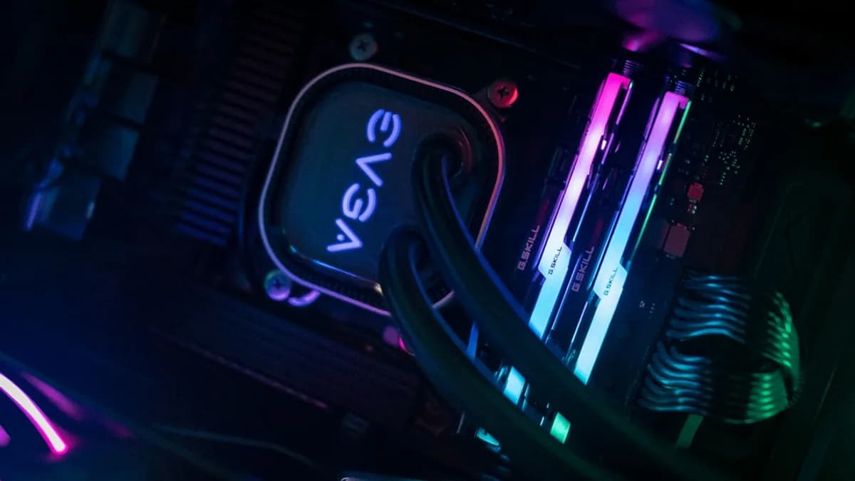 a close up of a computer and wires in a dark room