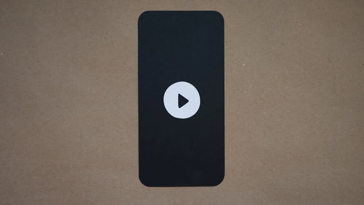 a black device with a play button on it