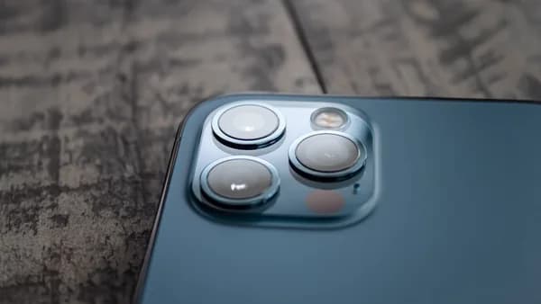 blue and white device on brown marble table