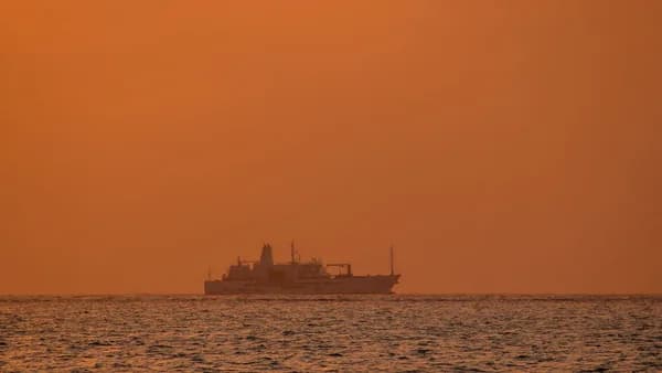 a large boat floating on top of a large body of water