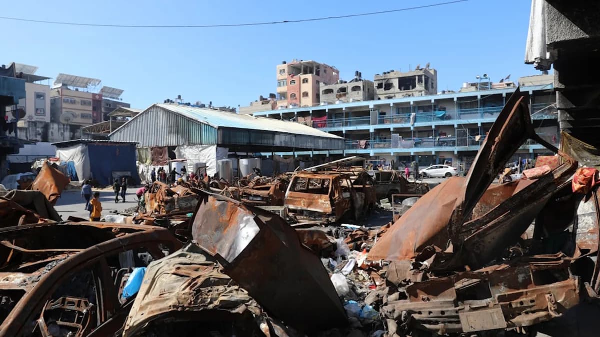 A man standing next to a pile of junk