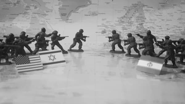 Toy soldiers in formation with flags on world map