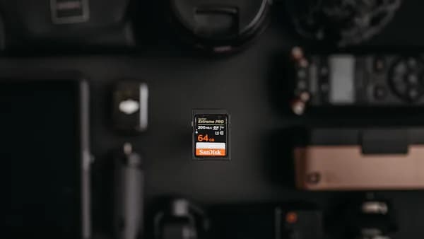 Camera accessories arranged on a dark surface