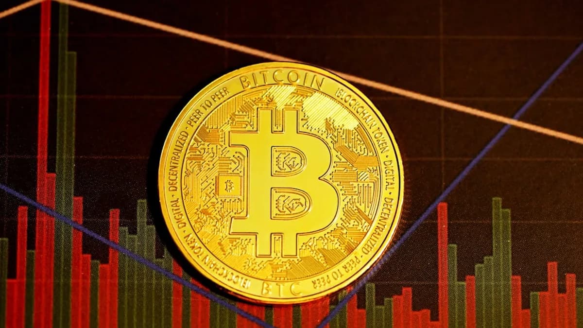 gold round coin on red and black textile
