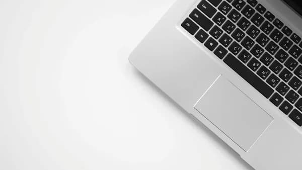 MacBook Pro on white surface