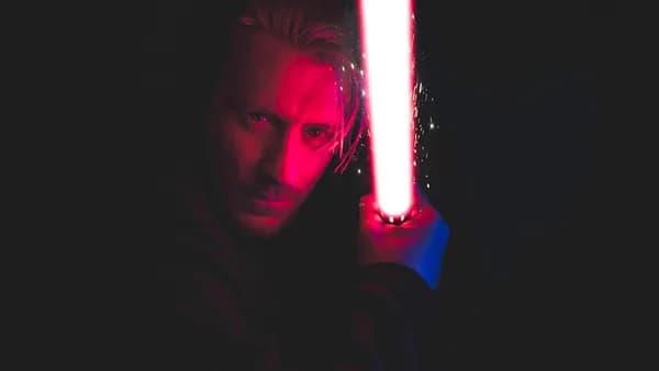 person holding red lightsaber