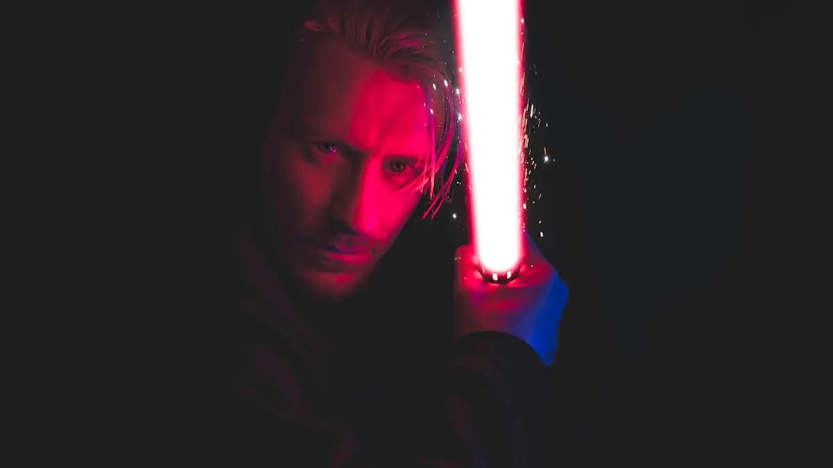 person holding red lightsaber