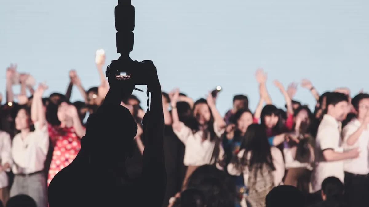 silhouette of person using DSLR camera