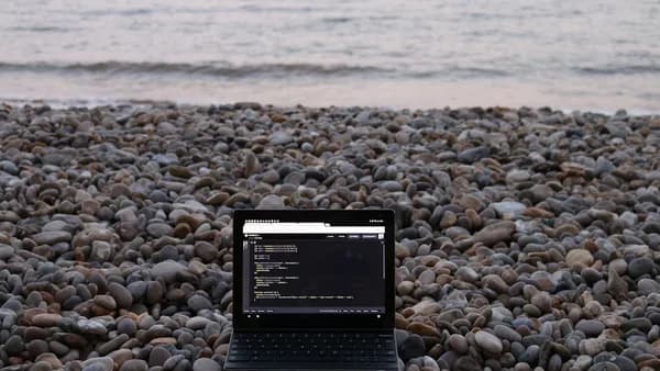 a tablet on a rocky beach
