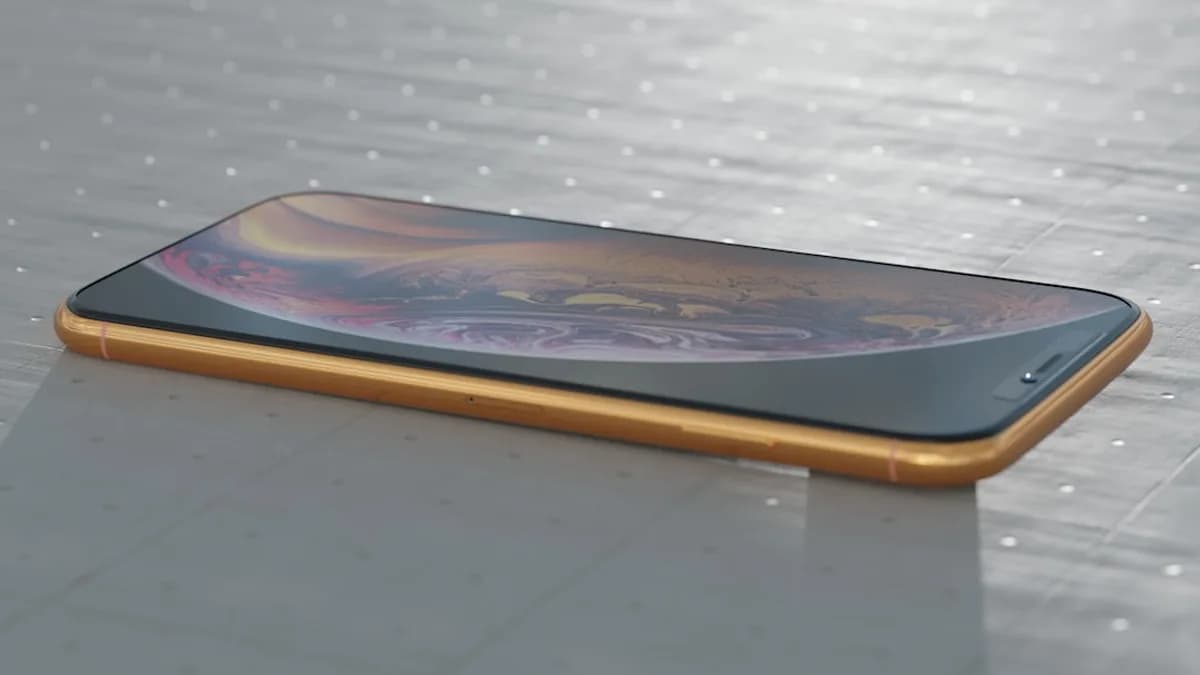 an iphone on a table with water droplets