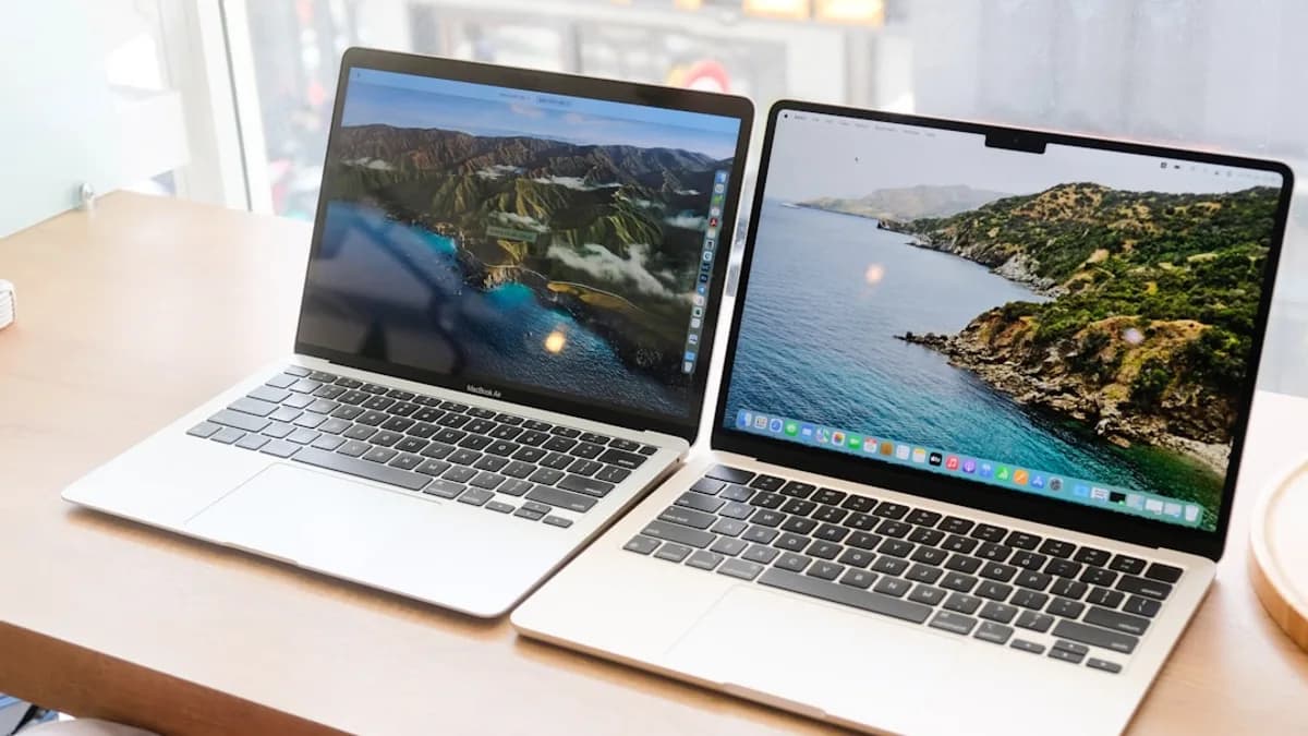 a couple of laptops on a table