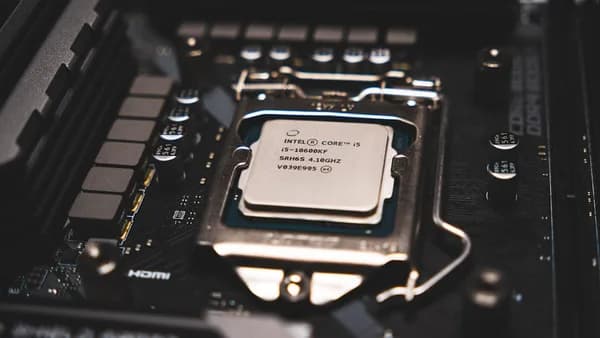 A cpu chip sitting on top of a computer