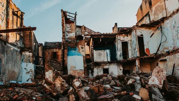 a destroyed building with debris all over it