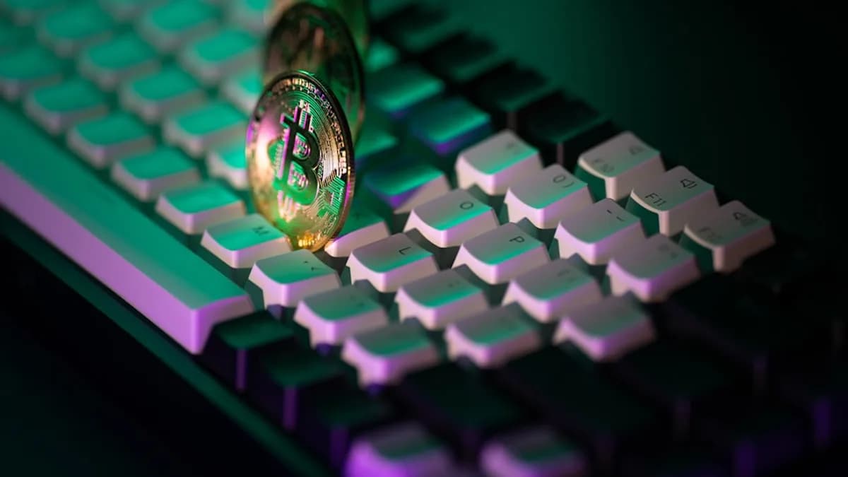 A close up of a computer keyboard with a light on it