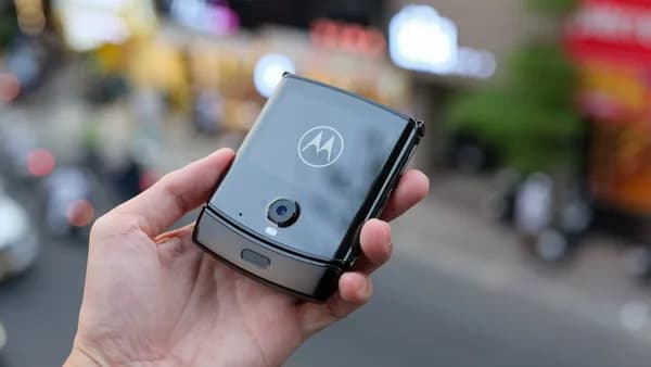 a person holding a smart phone in their hand