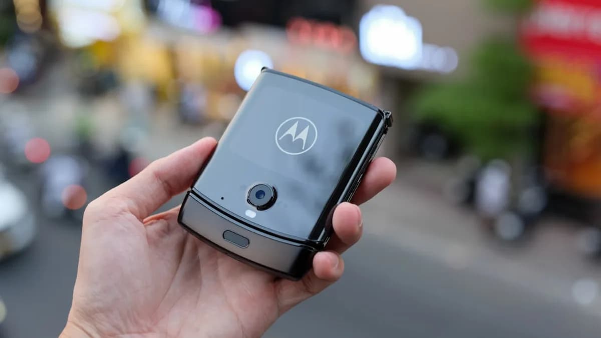 a person holding a smart phone in their hand