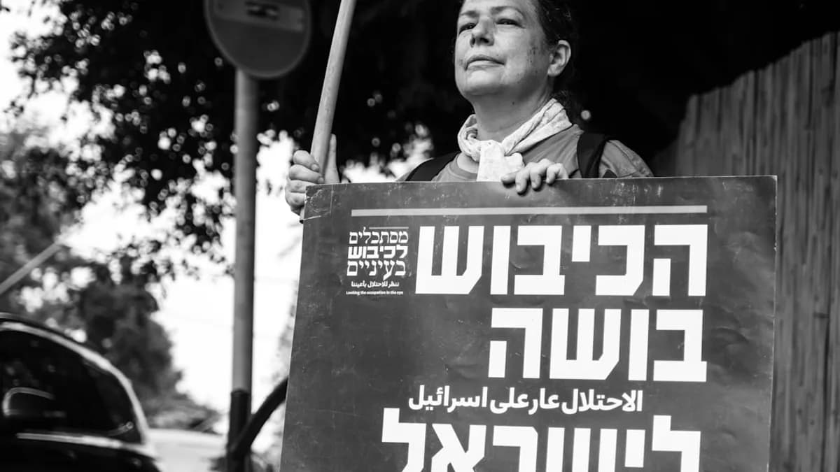 a man holding a sign