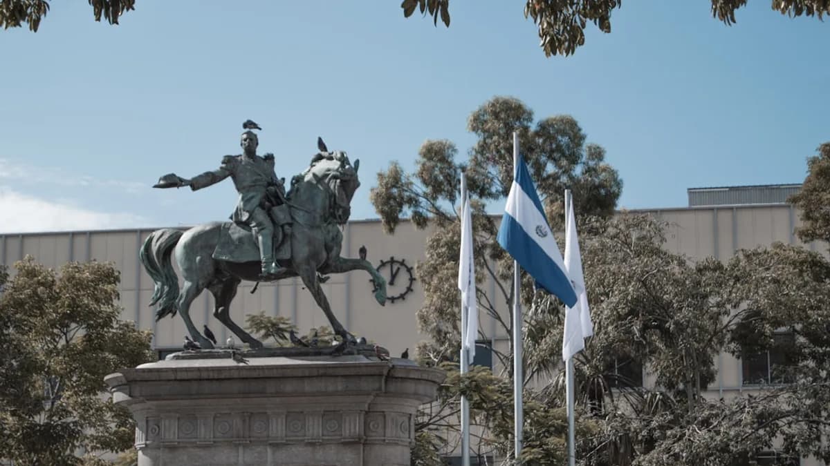 a statue of a man on a horse in front of a building
