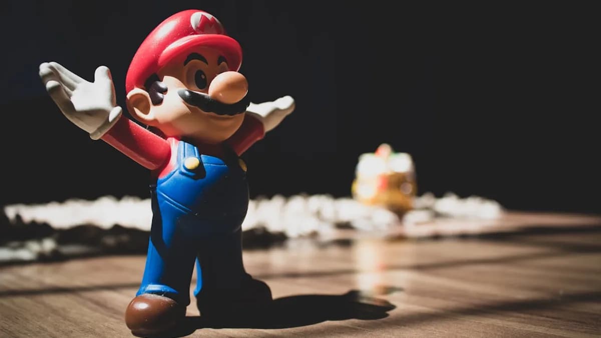 Super Mario figurine on brown surface