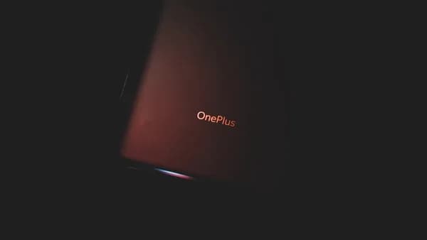red lenovo laptop computer on white surface