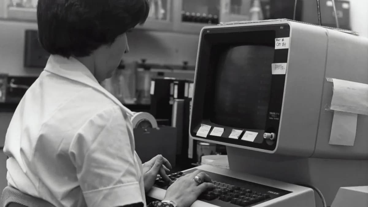 grayscale photography of unknown person using computer