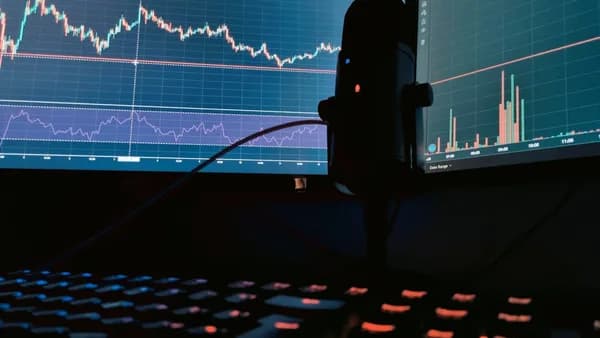 a computer monitor with a keyboard and mouse