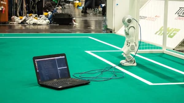 black tablet computer on green table