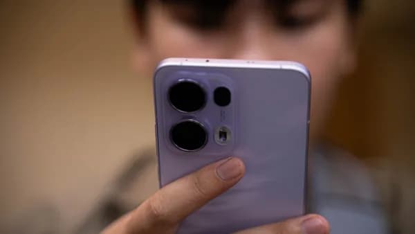 A close up of a person holding a cell phone