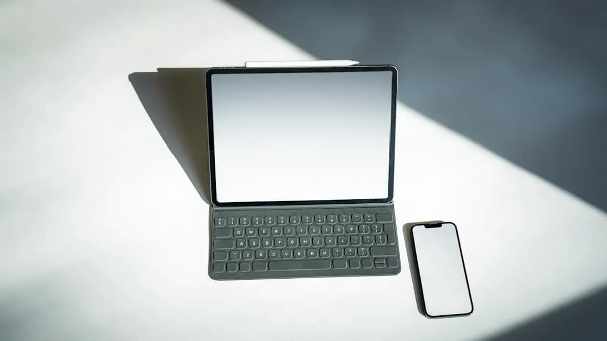 a tablet and a cell phone sitting on a table