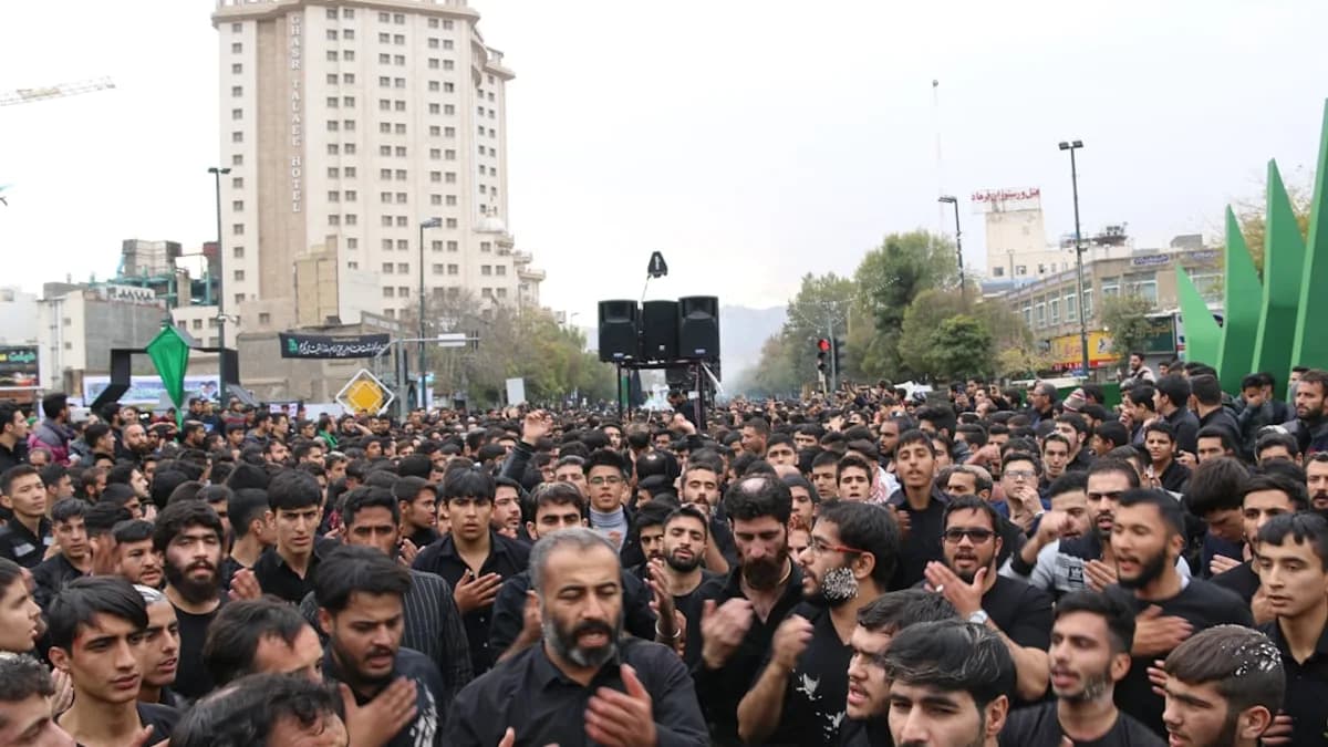 crowd of people gathered near high-rise building