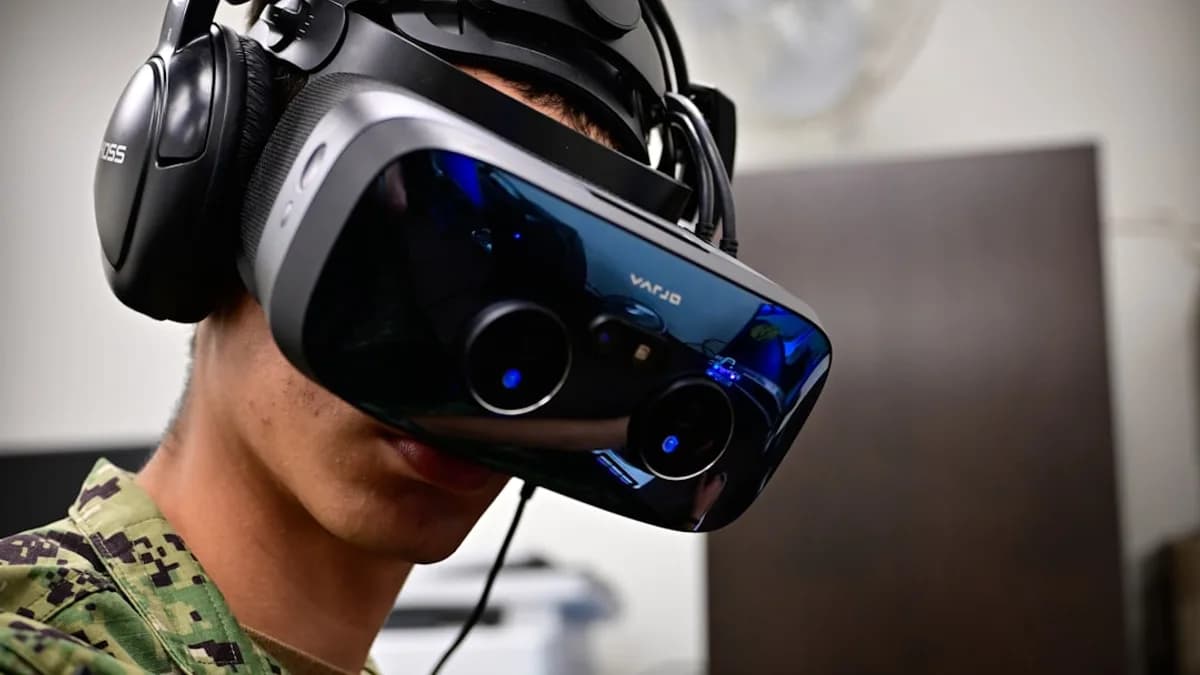 Person wearing a virtual reality headset and headphones.