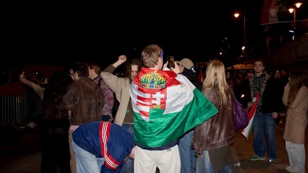 Crowd with hungarian flag at night