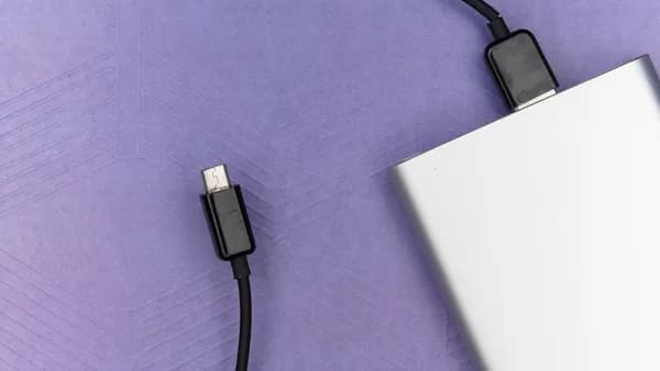 black usb cable on white laptop computer