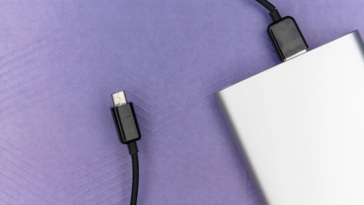 black usb cable on white laptop computer