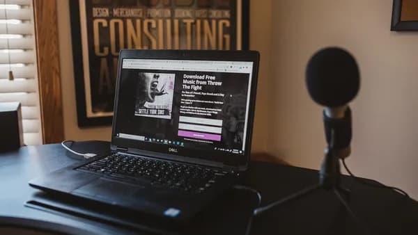 a laptop computer sitting on top of a desk