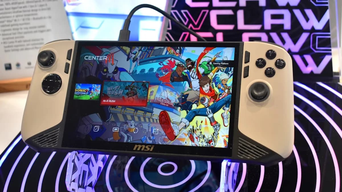 Handheld gaming device with colorful game display.