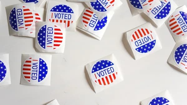 Voted printed papers on white surface